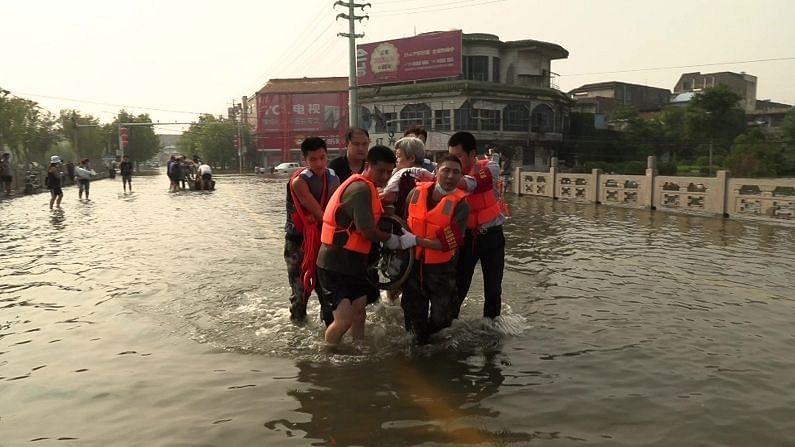 China flood : ચીનમાં ભારે વરસાદે તારાજી સર્જી, હજારો લોકો પ્રભાવિત થયા 21ના ​​મોત