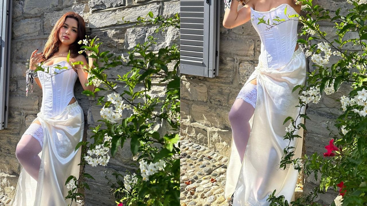 અવનીત કૌર દિવાલ સામે ઉભા રહીને સનકીસ પોઝ આપી રહી છે.