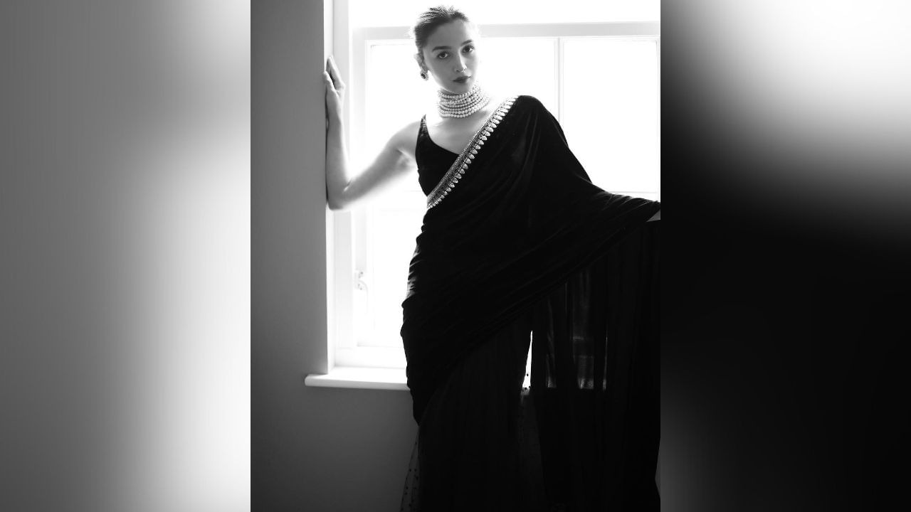 In these pictures, Alia Bhatt is seen striking a killer pose in a black saree. (Image: Instagram)